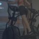 Close-Up of Woman on Cross Trainer at the Gym