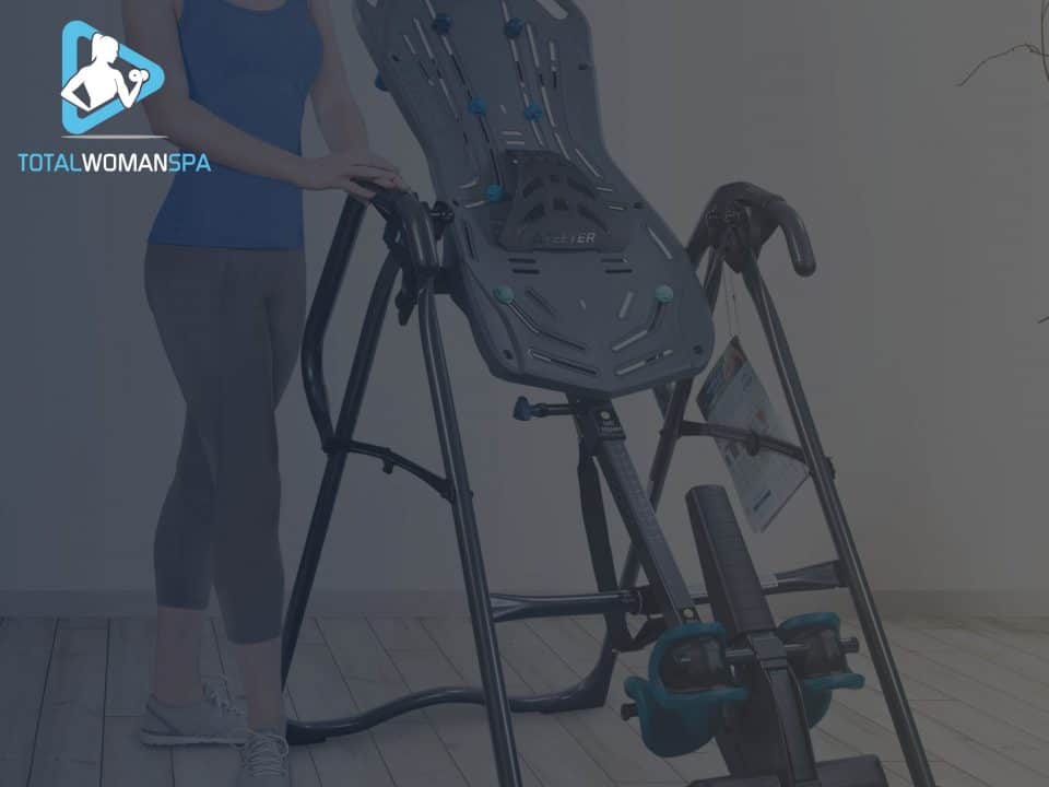 Woman Sits Next to Inversion Table at Home